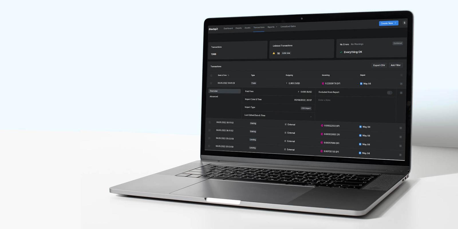 Blockpit transactions table in dark mode on a tilted laptop, with an open row showing fees and import details
